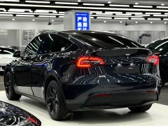 Tesla Model Y Rear-Wheel Drive - ფოტო 4