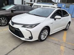 Toyota Corolla 2021 Hybrid 1.8L E-CVT Elite - ფოტო 1