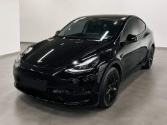 Tesla Model Y Standard Range RWD - ფოტო 1