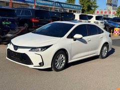 Toyota Corolla 2021 Hybrid 1.8L E-CVT Elite - ფოტო 1