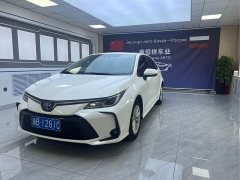 Toyota Corolla 2021 Hybrid 1.8L E-CVT Elite - ფოტო 1