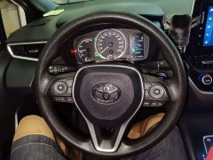 Toyota Corolla Hybrid 1.8H E-CVT Luxury - ფოტო 11