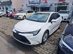 Toyota Corolla 2022 Hybrid 1.8H E-CVT Luxury - ფოტო 1