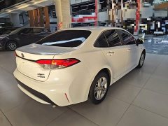 Toyota Corolla Hybrid 1.8H E-CVT Luxury - ფოტო 7