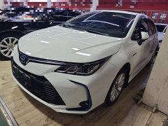 Toyota Corolla 2021 Hybrid 1.8L E-CVT Elite - ფოტო 2