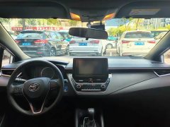 Toyota Corolla Hybrid 1.8H E-CVT Base - ფოტო 7