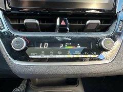 Toyota Corolla Hybrid 1.8H E-CVT Sport - ფოტო 13