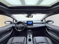 Toyota Corolla Hybrid 1.8H E-CVT Luxury - ფოტო 16
