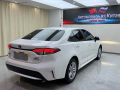 Toyota Corolla Hybrid 1.8H E-CVT Luxury - ფოტო 4