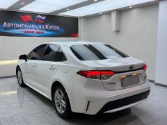 Toyota Corolla Hybrid 1.8H E-CVT Luxury - ფოტო 6