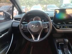 Toyota Corolla Hybrid 1.8H E-CVT Luxury - ფოტო 10