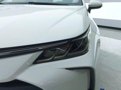 Toyota Corolla Dual-Engine 1.8L E-CVT Pioneer Edition - ფოტო 4